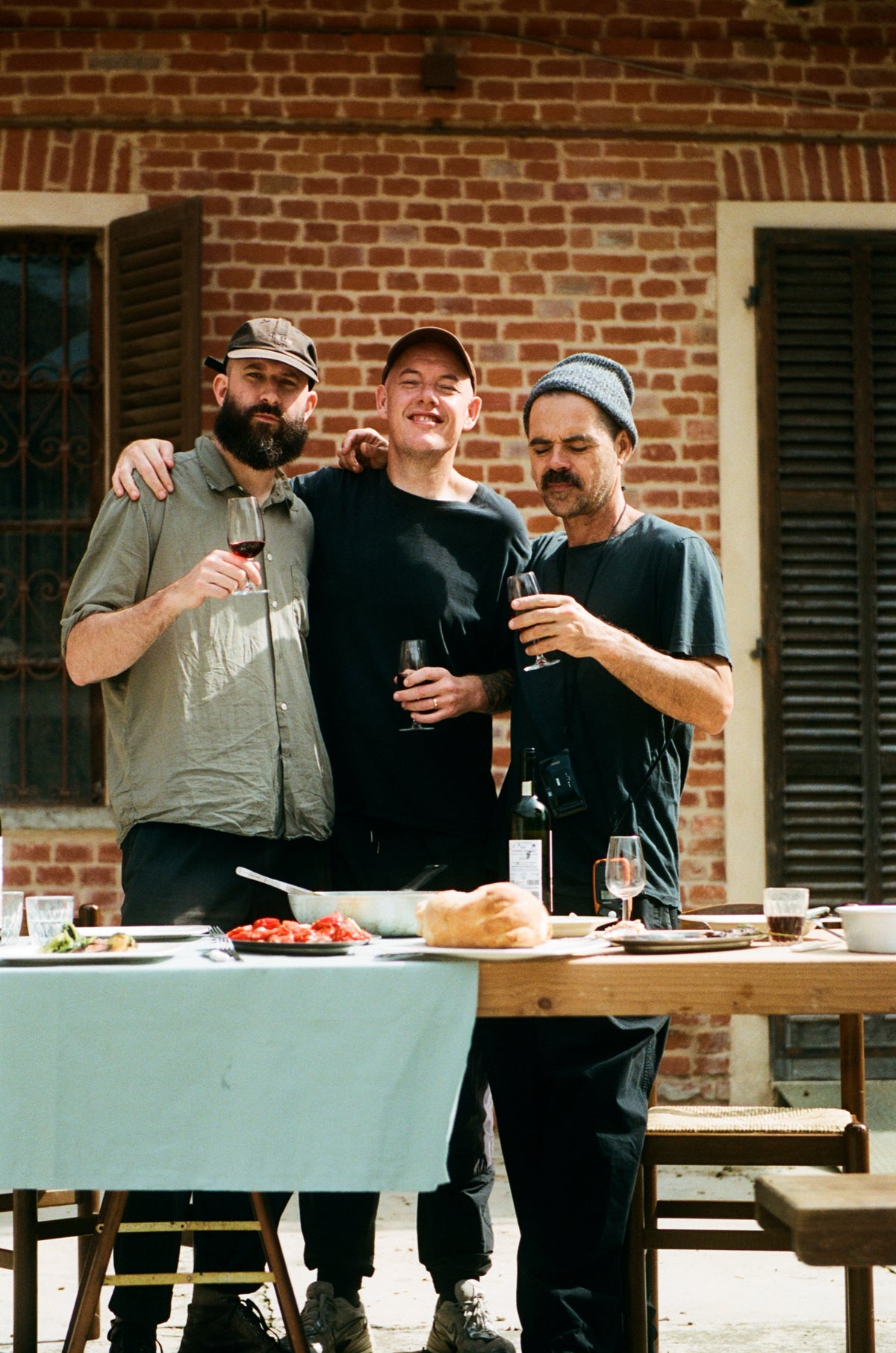 The team behind the book at a long table in Piemonte